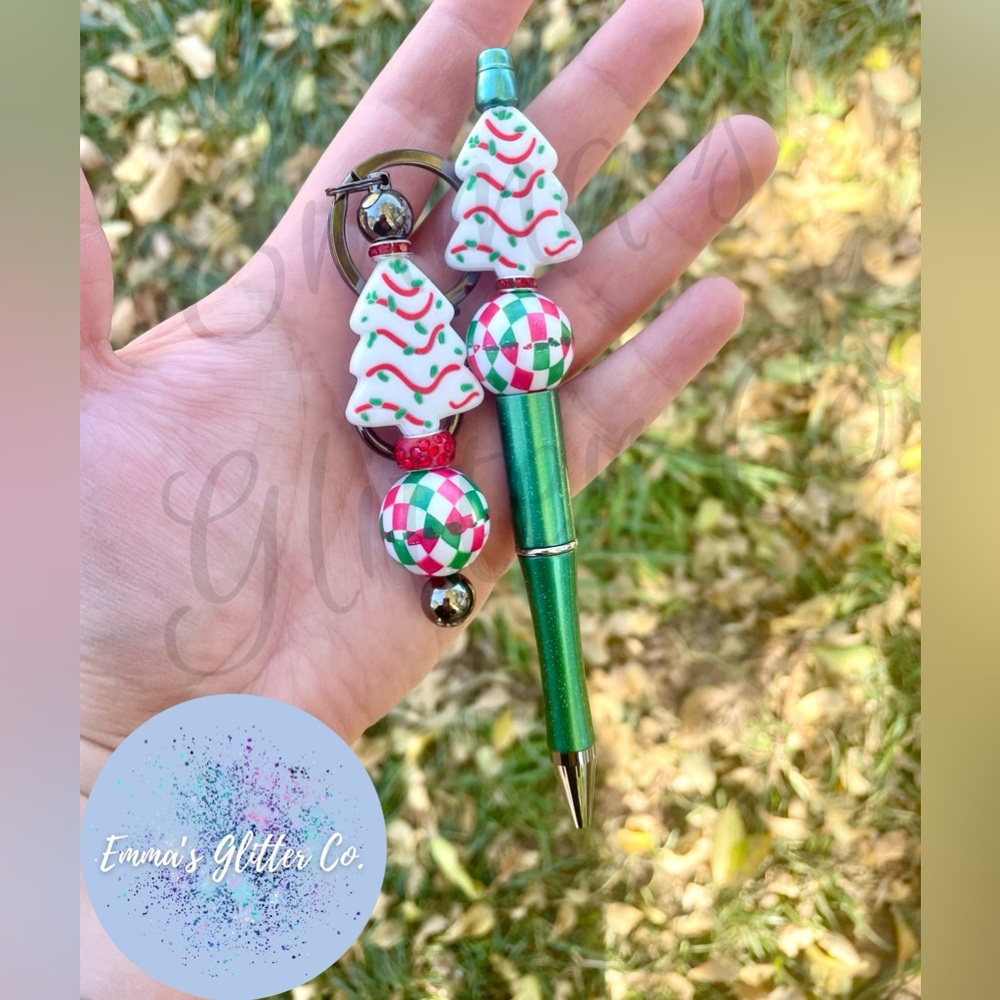 Emma’s Glitter Co. Christmas Tree Cake beaded pen and keychain set.